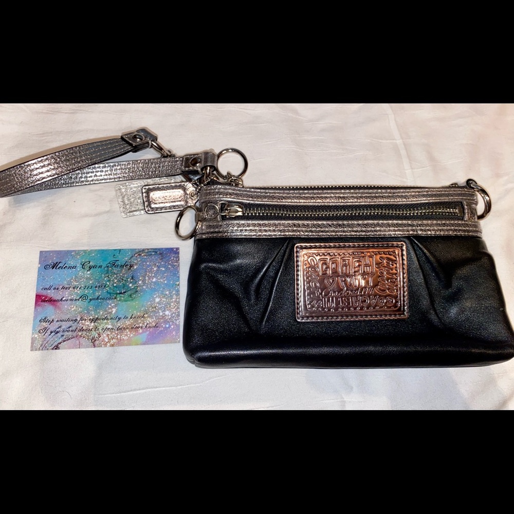 Black leather coachpoppy wristlet